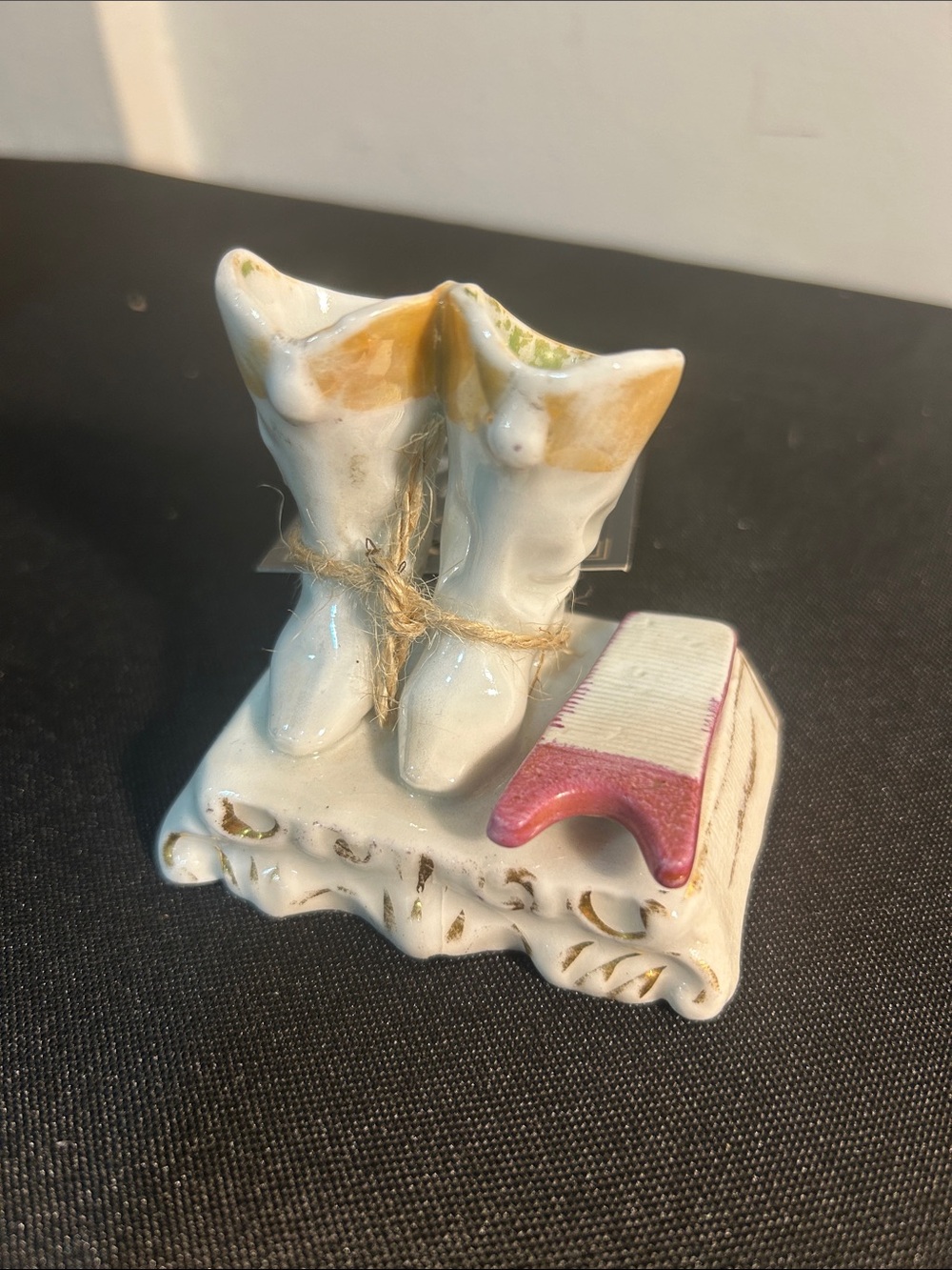 Antique boot match holder and Stryker